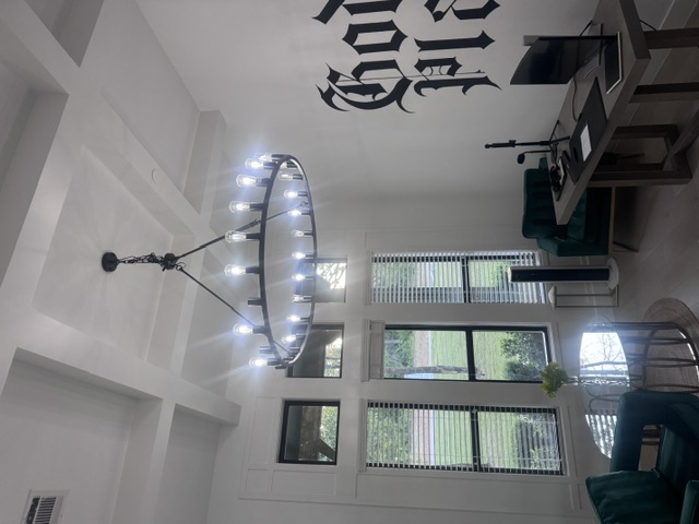 Finished office with coffered ceiling and wagon-wheel chandelier